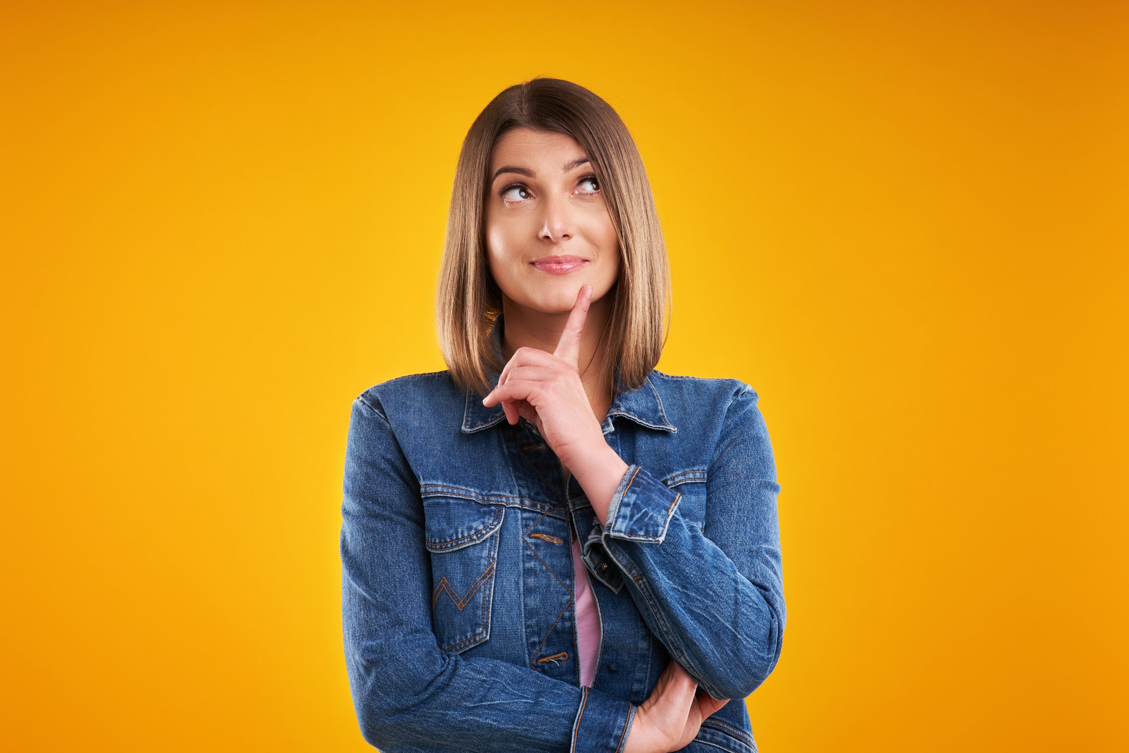  Woman in Denim Jacket Thinking and Pointing  